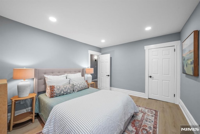 bedroom featuring light hardwood / wood-style floors