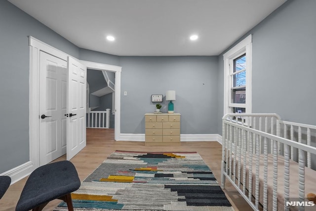 bedroom with light wood-type flooring