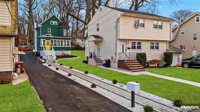 view of front of home with a front lawn