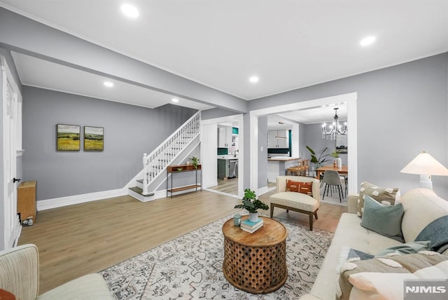 living room featuring hardwood / wood-style floors and a chandelier