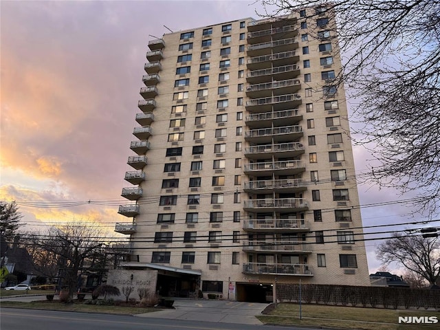 view of outdoor building at dusk