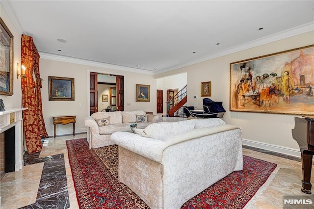 living room featuring a high end fireplace and crown molding