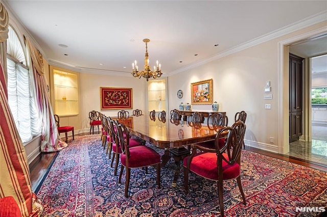 dining room featuring ornamental molding, hardwood / wood-style flooring, and a notable chandelier