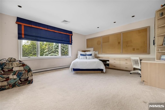 bedroom with baseboard heating and light colored carpet