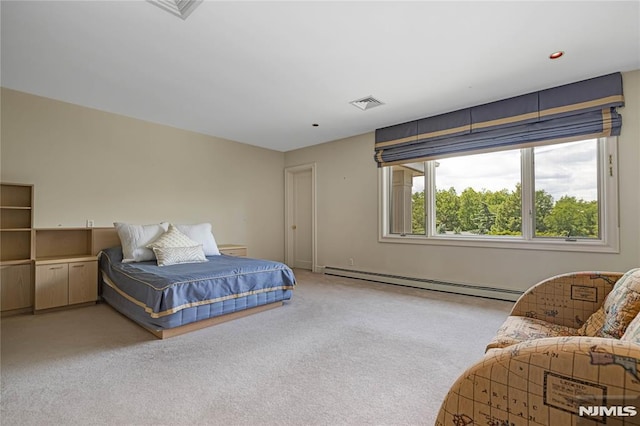 carpeted bedroom with a baseboard heating unit