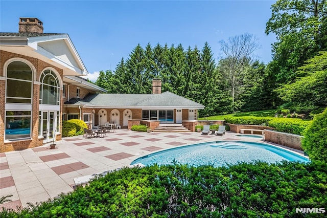 view of pool with a patio area