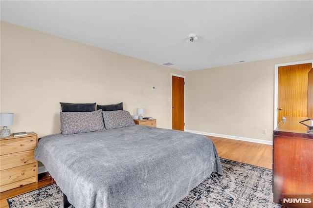 bedroom featuring hardwood / wood-style floors