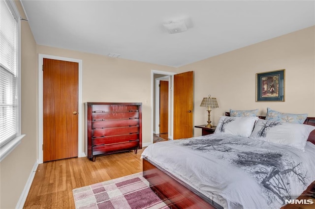 bedroom featuring light wood-type flooring