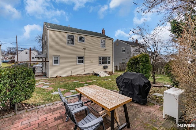 back of house with a patio area