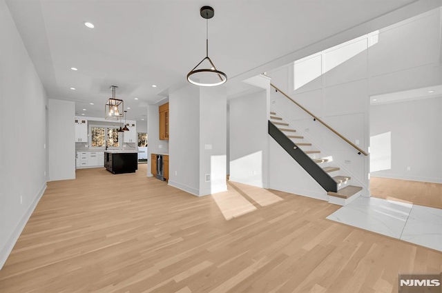 unfurnished living room featuring light wood-type flooring