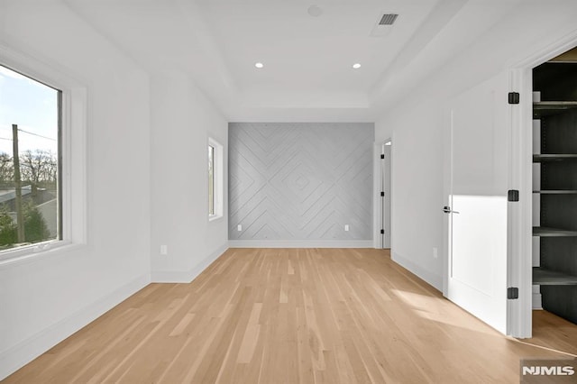 unfurnished room with light hardwood / wood-style floors