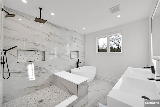 bathroom with sink and separate shower and tub