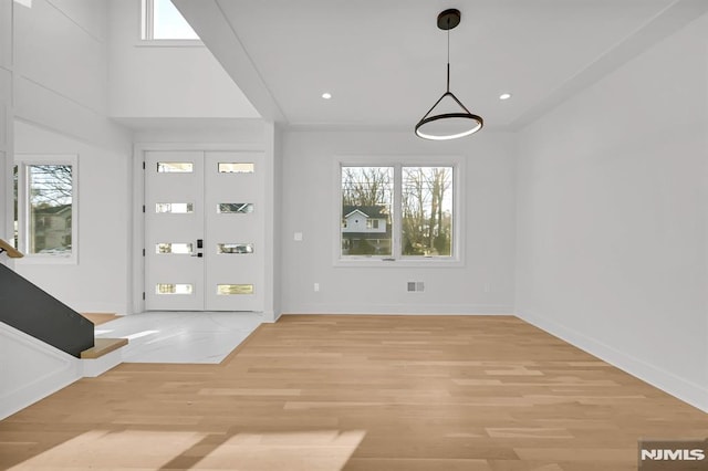 interior space featuring french doors and light hardwood / wood-style flooring