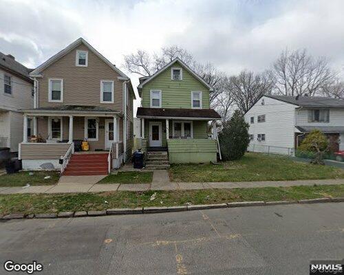 view of front of home with a front lawn and a porch