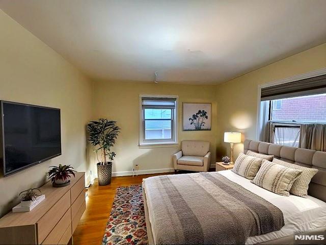 bedroom featuring light wood-type flooring