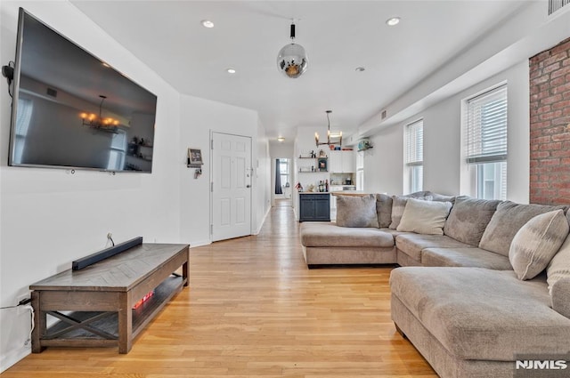 living room with light hardwood / wood-style flooring