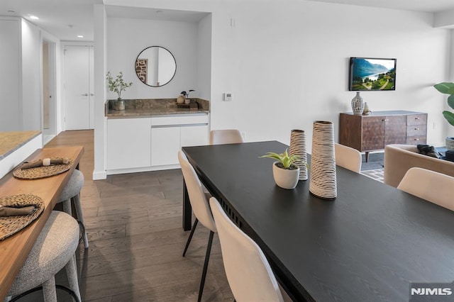 dining area with dark wood-type flooring