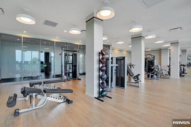 exercise room featuring light hardwood / wood-style flooring