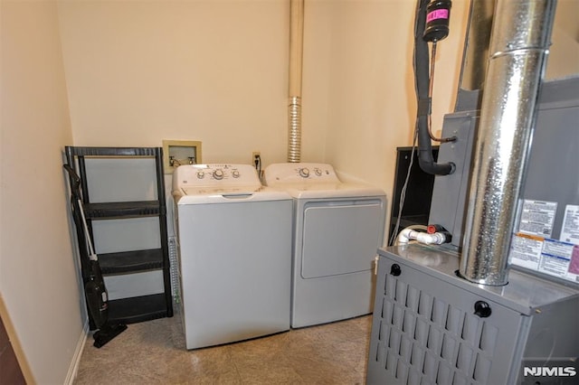 washroom with washing machine and dryer