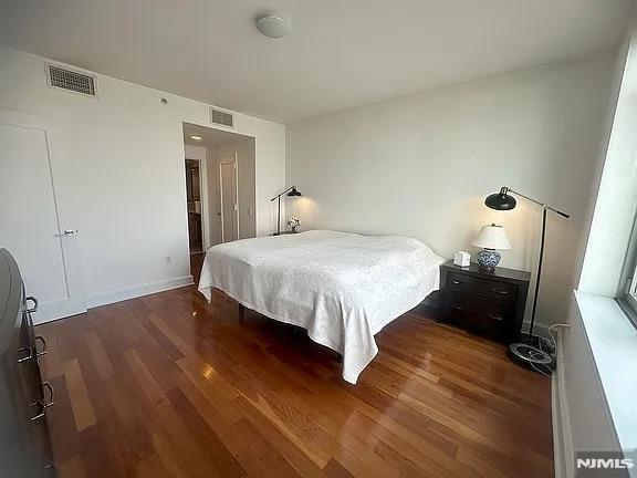 bedroom featuring dark hardwood / wood-style floors