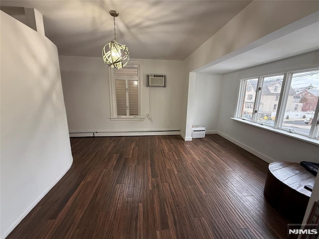 interior space featuring a baseboard radiator, a wall mounted AC, and dark hardwood / wood-style flooring