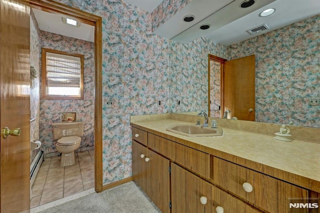 bathroom featuring toilet, vanity, tile patterned floors, and a baseboard radiator