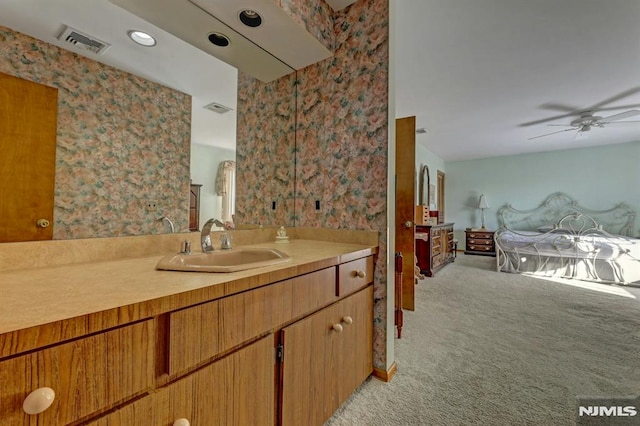 bathroom featuring ceiling fan and vanity