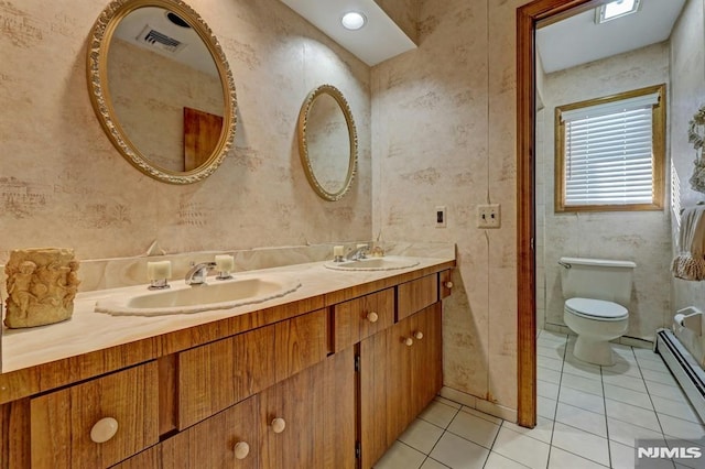 bathroom with toilet, tile patterned flooring, vanity, and a baseboard radiator