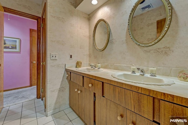 bathroom with tile patterned floors and vanity