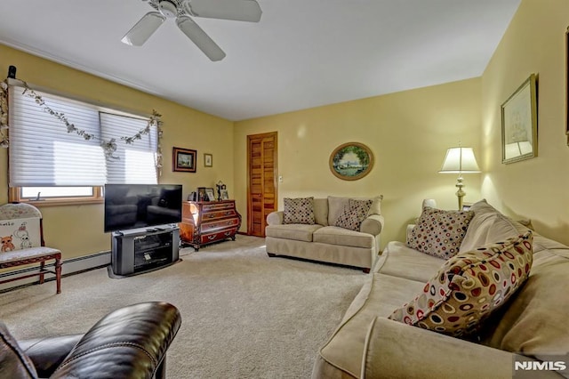 living room featuring ceiling fan, a baseboard heating unit, and carpet flooring