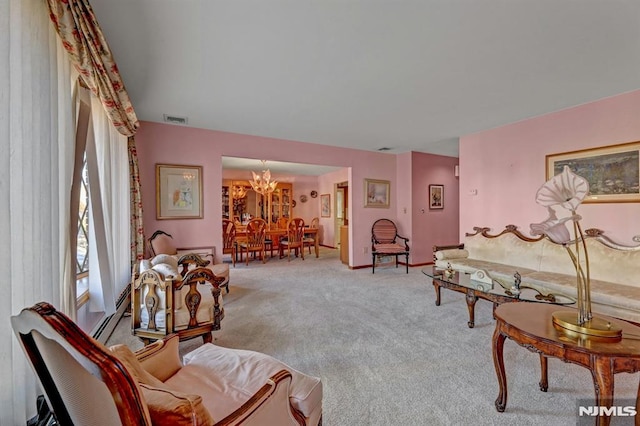 living room featuring light carpet and a notable chandelier