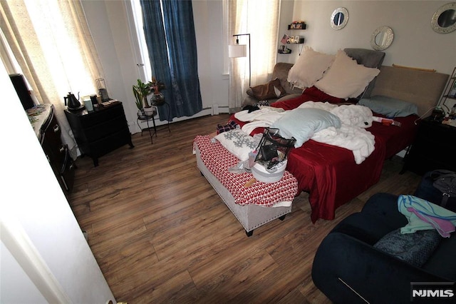 bedroom featuring dark wood-type flooring