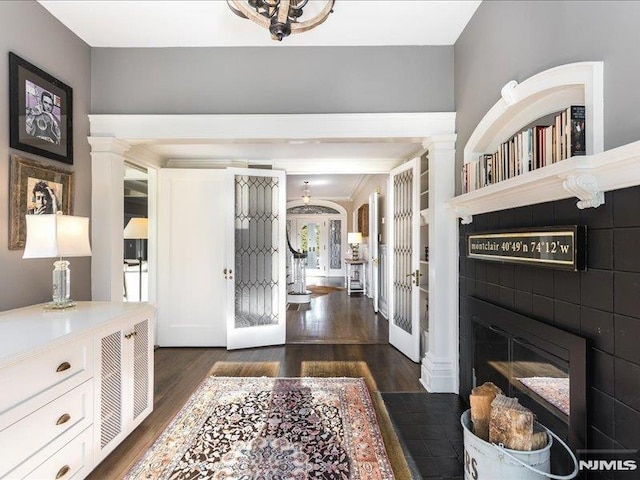 foyer entrance featuring dark hardwood / wood-style flooring and french doors