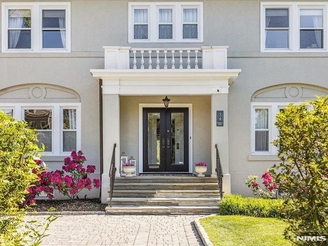 doorway to property featuring french doors