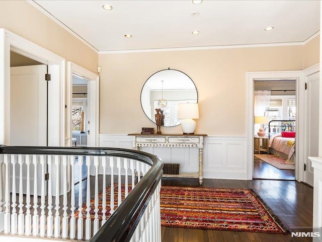 hallway featuring dark hardwood / wood-style flooring and ornamental molding