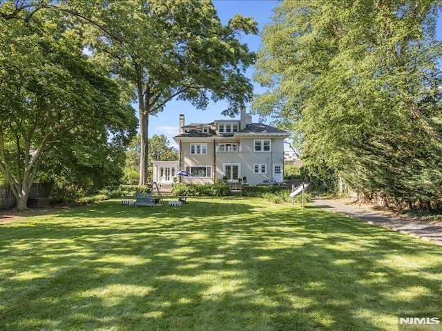 exterior space featuring a wooden deck and a yard