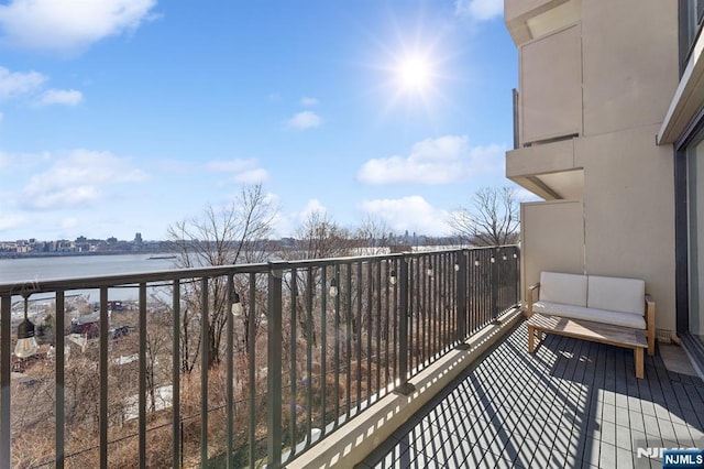 balcony featuring a water view