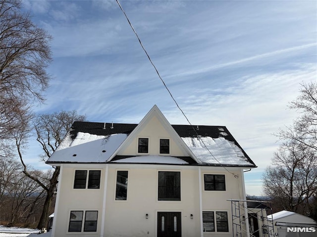 view of snow covered house