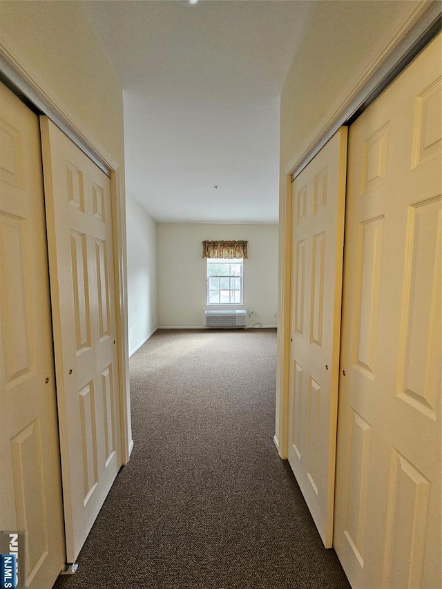 hall with dark carpet