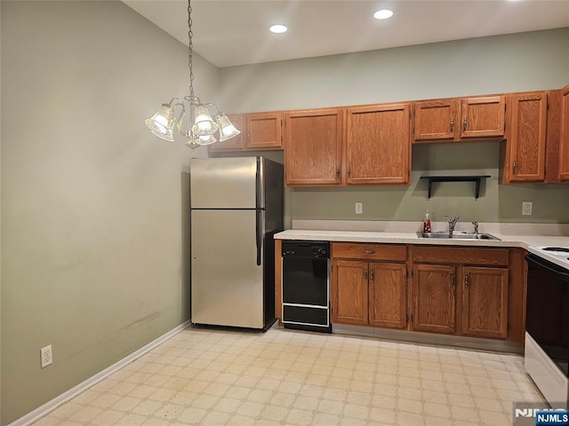 kitchen featuring dishwasher, an inviting chandelier, sink, hanging light fixtures, and stainless steel fridge