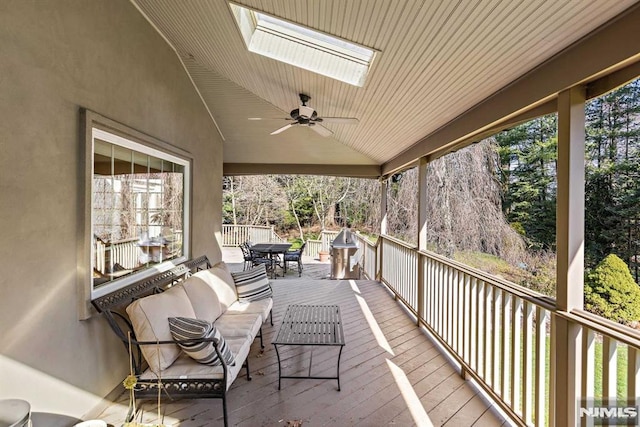 wooden deck with ceiling fan