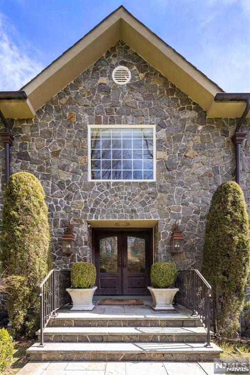 property entrance featuring french doors