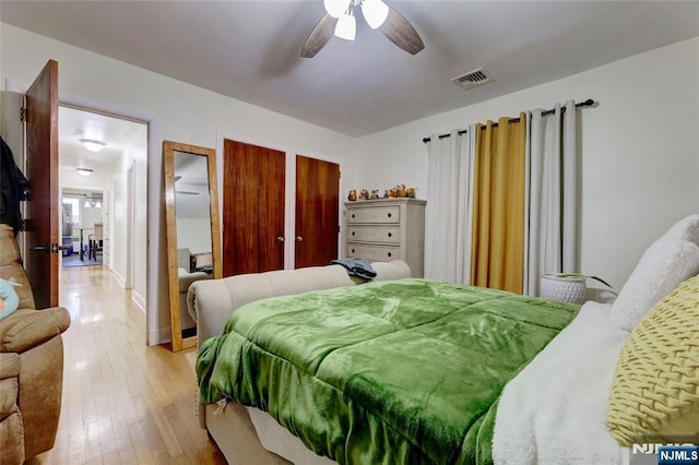 120 Prospect Ave, Hackensack, NJ 07601 - bedroom featuring multiple closets, ceiling fan, and light hardwood / wood-style floors