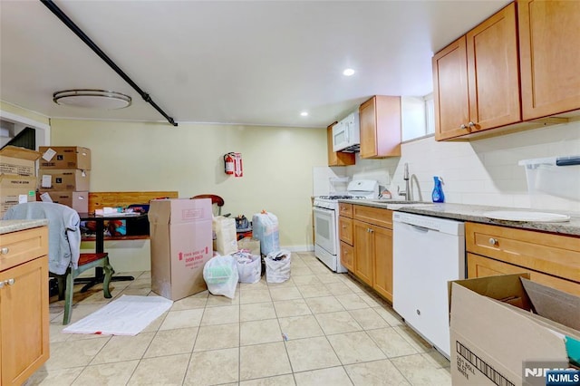 120 Prospect Ave, Hackensack, NJ 07601 - kitchen with sink, white appliances, light tile patterned floors, and backsplash