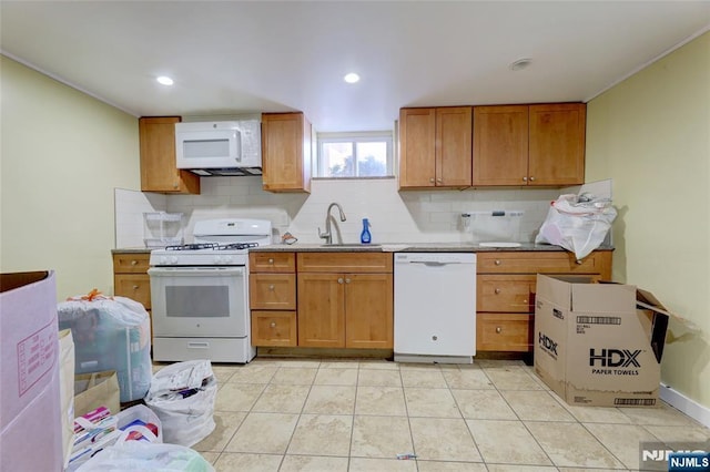 120 Prospect Ave, Hackensack, NJ 07601 - kitchen with tasteful backsplash, sink, light tile patterned floors, and white appliances