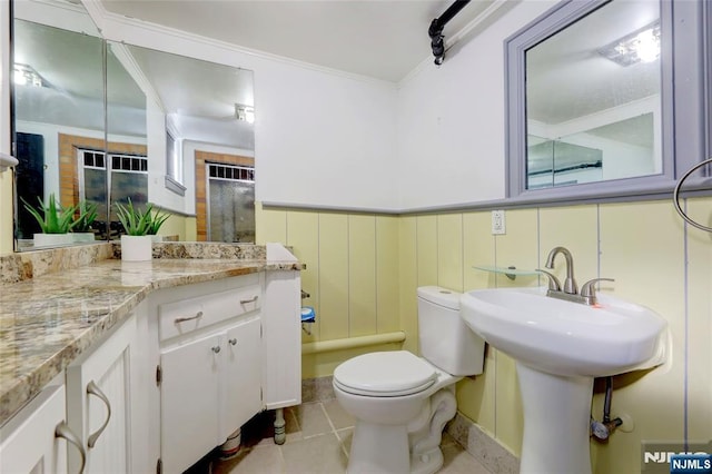 120 Prospect Ave, Hackensack, NJ 07601 - bathroom with tile patterned flooring, ornamental molding, and toilet