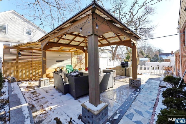 120 Prospect Ave, Hackensack, NJ 07601 - snow covered patio with an outdoor living space, a gazebo, and exterior kitchen