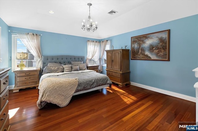 bedroom featuring dark wood finished floors, visible vents, multiple windows, and baseboards