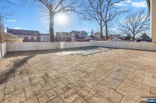 view of patio / terrace featuring a residential view and a fenced backyard