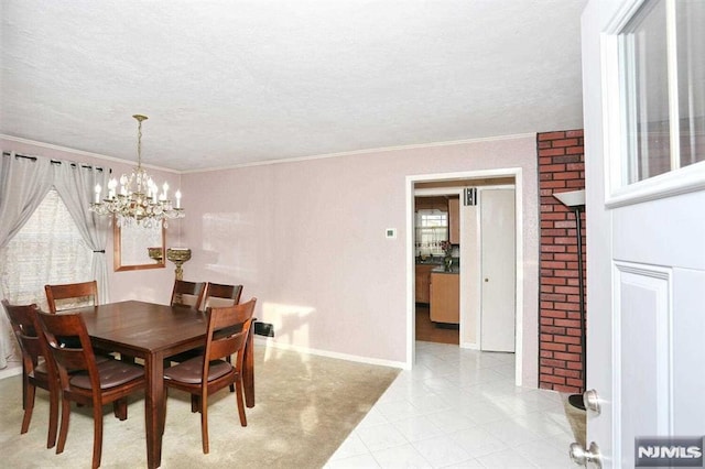 dining space featuring a chandelier and crown molding